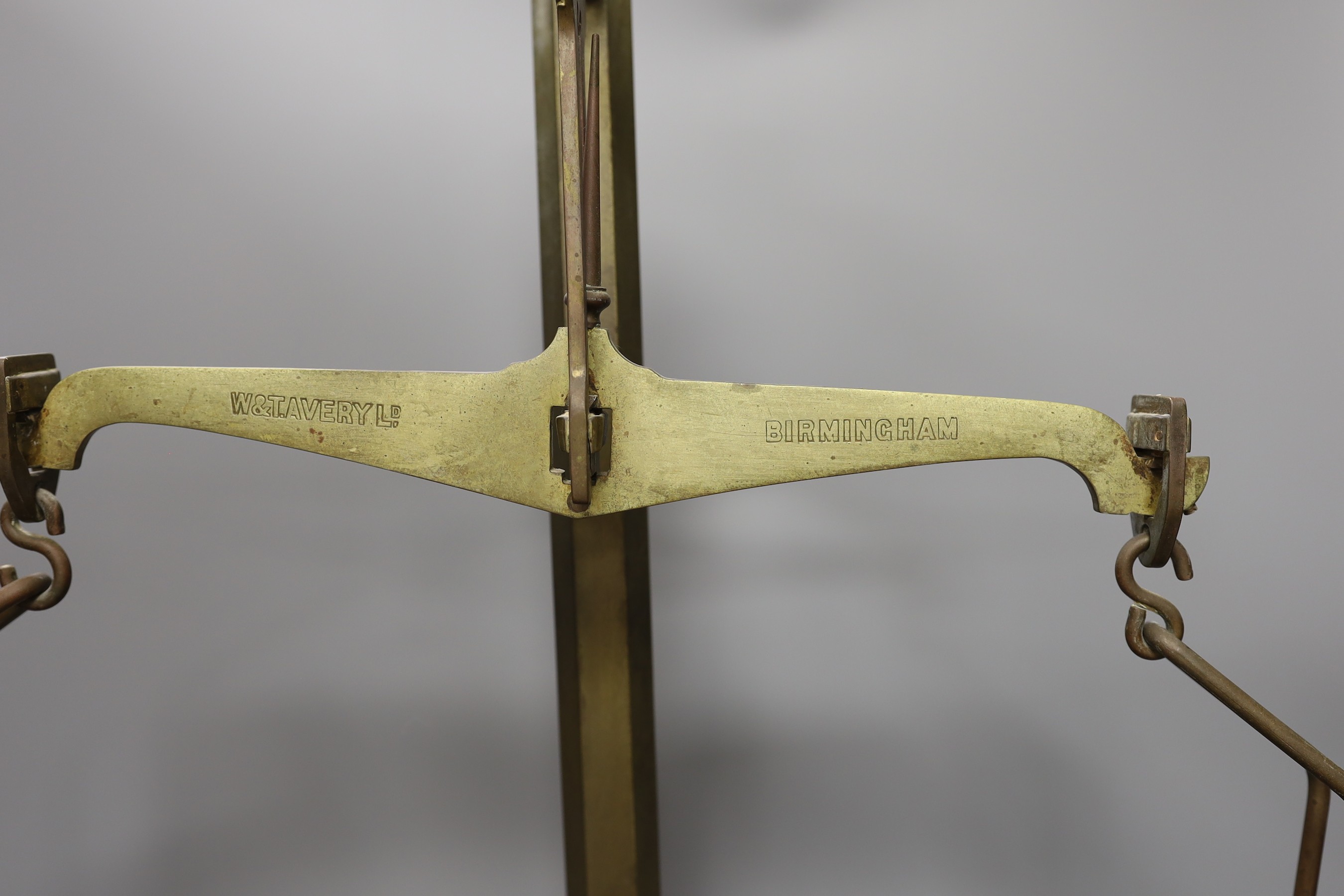 A set of grocer's scales by W&T. Avery Ltd., Birmingham with an 7 LB, two 4 LB, 2 LB and a 1 LB weights